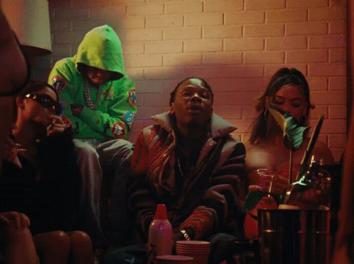 a group of people sitting on a couch in a room