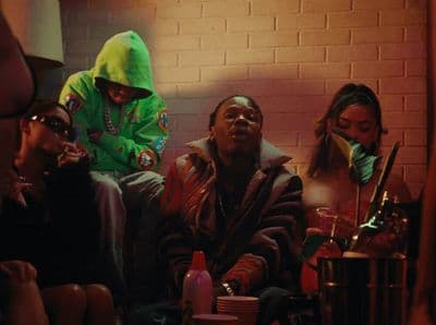 a group of people sitting on a couch in a room
