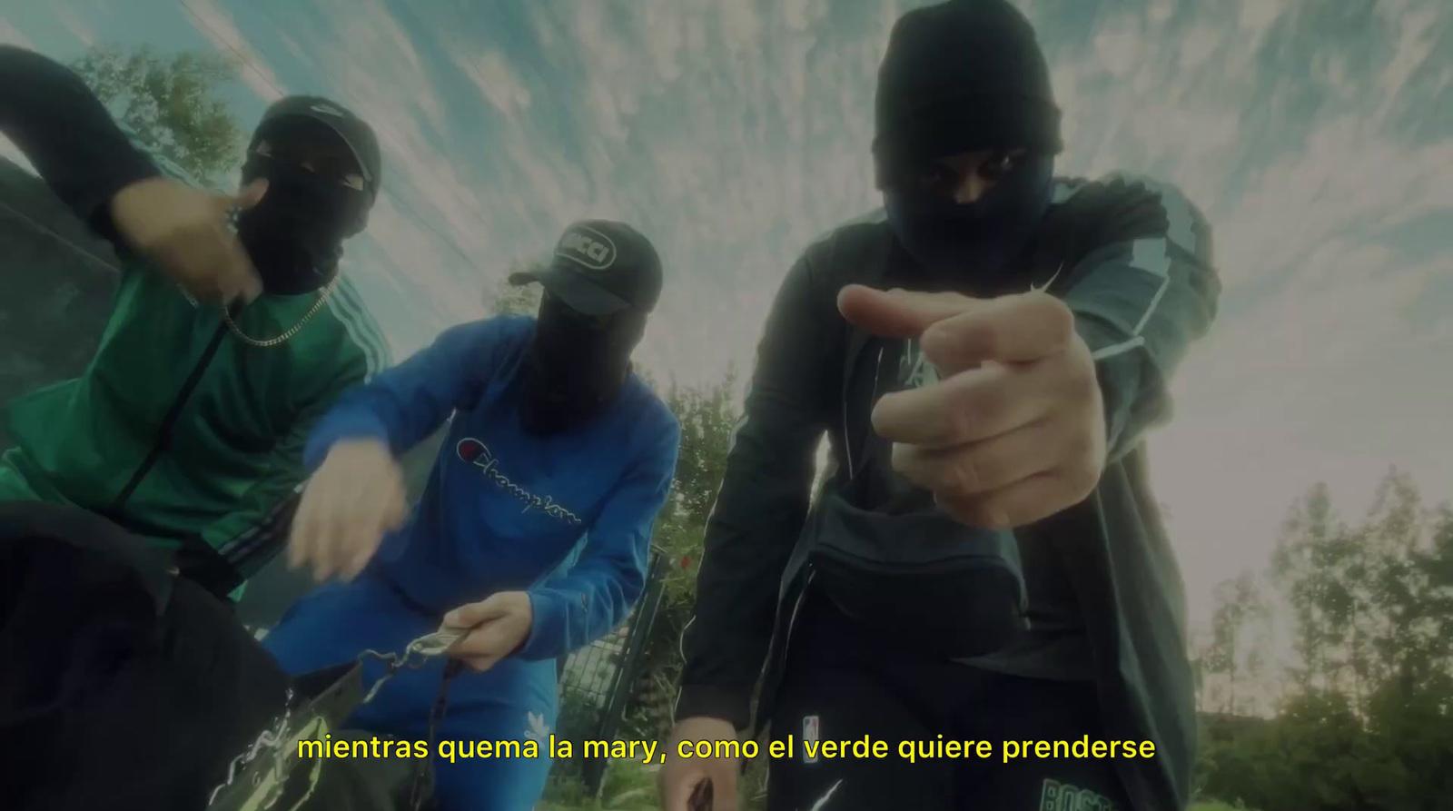 a group of people wearing masks pointing at something