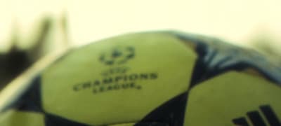 a close up of a soccer ball with a blurry background