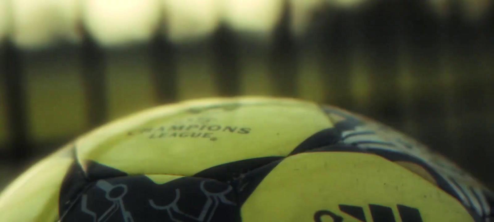 a close up of a yellow and black frisbee