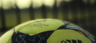 a close up of a yellow and black frisbee