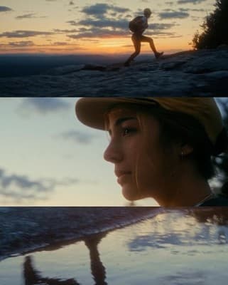 a woman walking on a beach next to the ocean