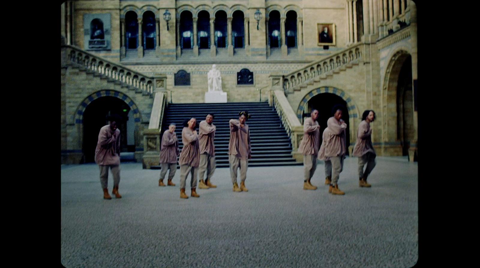a group of people standing in front of a building