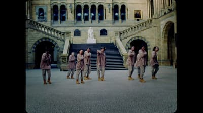 a group of people standing in front of a building