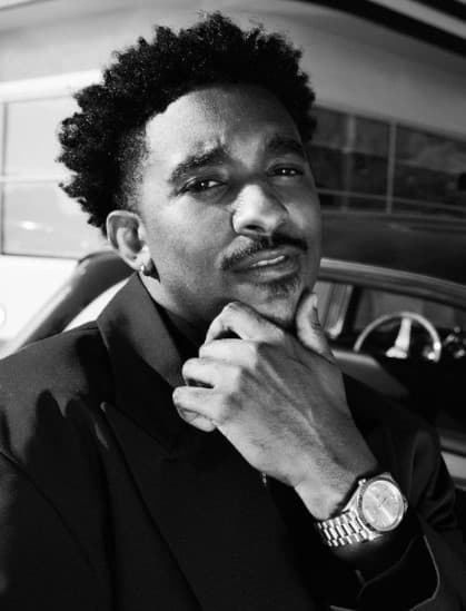 a black and white photo of a man in a suit