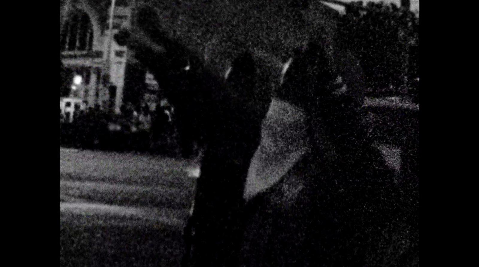 a blurry photo of a person holding an umbrella