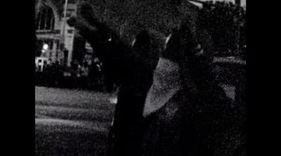 a blurry photo of a person holding an umbrella
