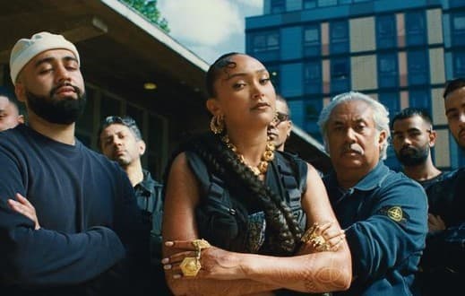 a group of people standing in front of a building