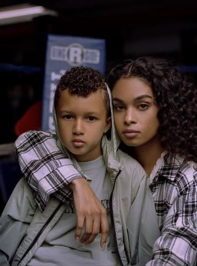 a young boy and a young girl sitting next to each other