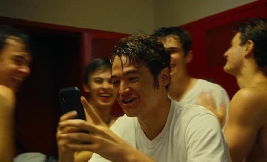 a man taking a picture of himself with his cell phone