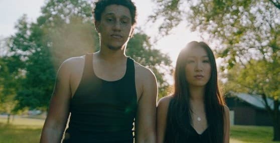 a man and a woman standing next to each other