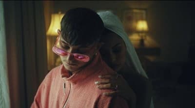 a man and a woman wearing pink goggles