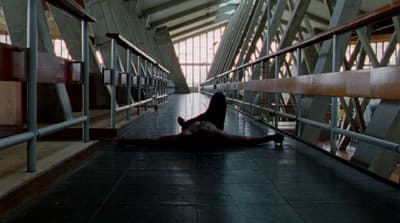 a person laying on the ground in a building