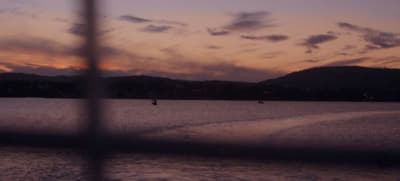 a boat traveling across a large body of water