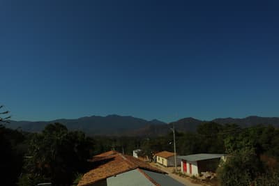 a view of a mountain range from a rooftop
