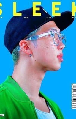 a man with glasses and a hat on the cover of a magazine