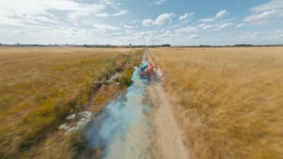 a train traveling through a dry grass field