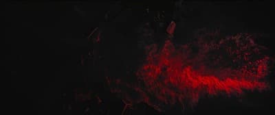 a red light is shining on a black background