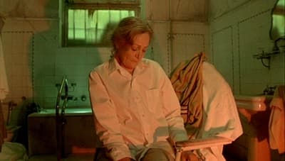 a woman sitting in a chair in a room