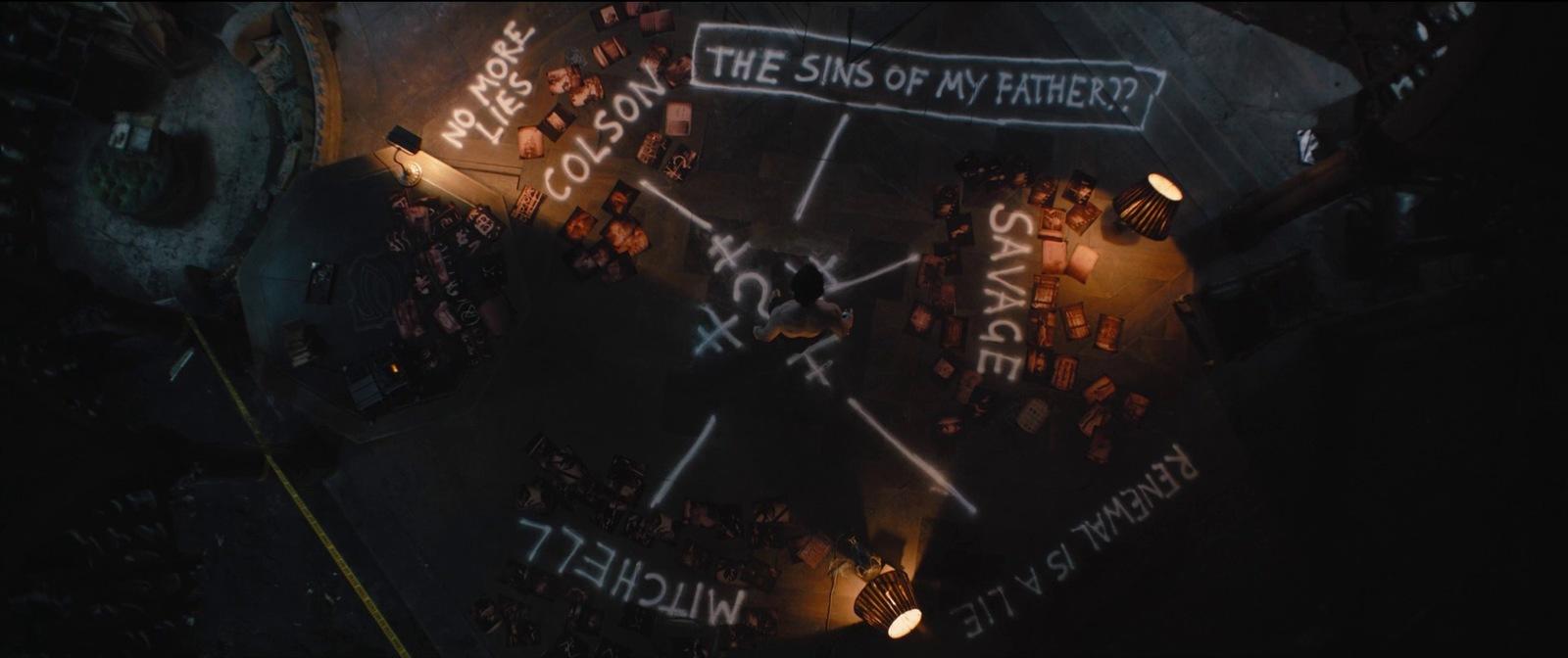a group of people sitting around a table with writing on it
