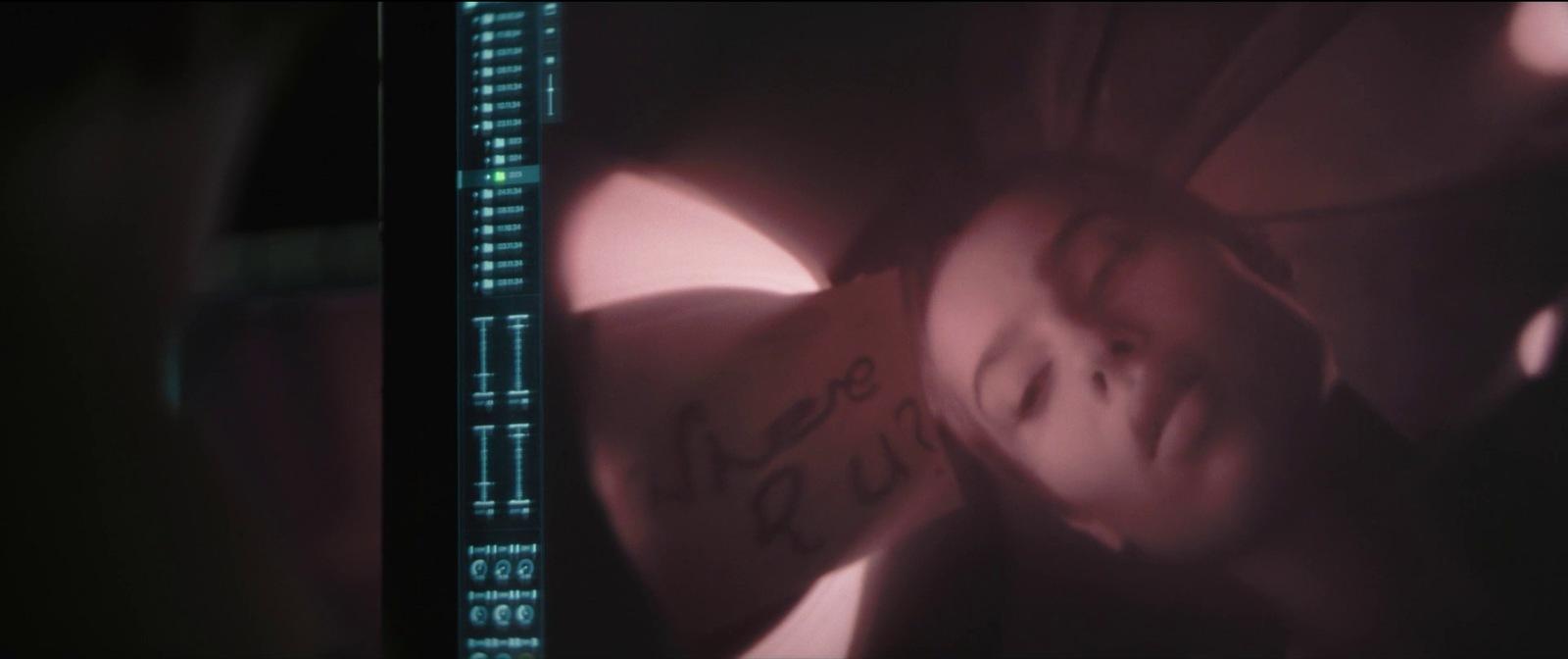 a blurry photo of a woman's face and arm