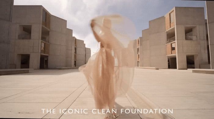 a blurry photo of a woman in a long dress