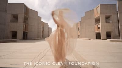 a blurry photo of a woman in a long dress