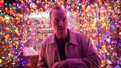 a man standing in front of a display of lights