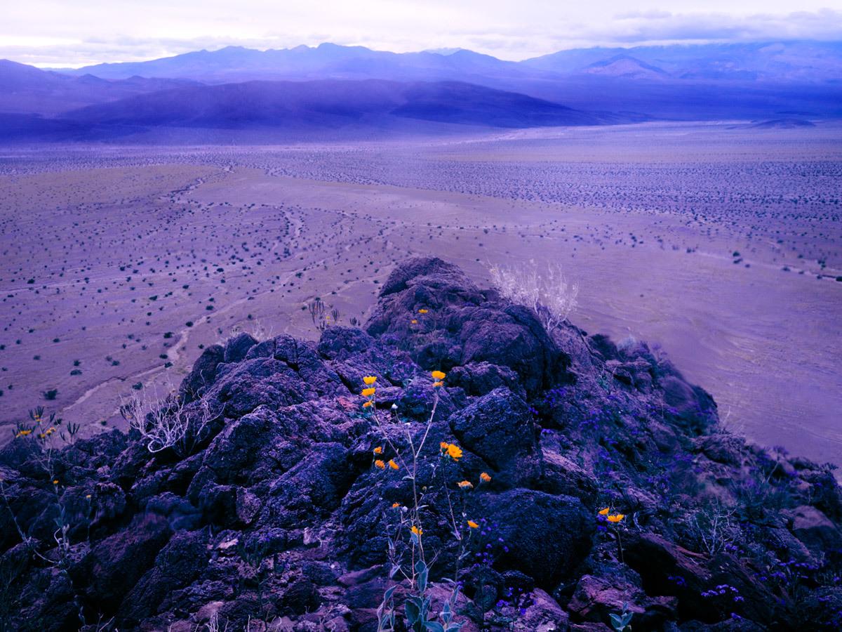 a rocky outcropping in the middle of a desert