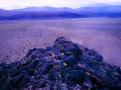 a rocky outcropping in the middle of a desert