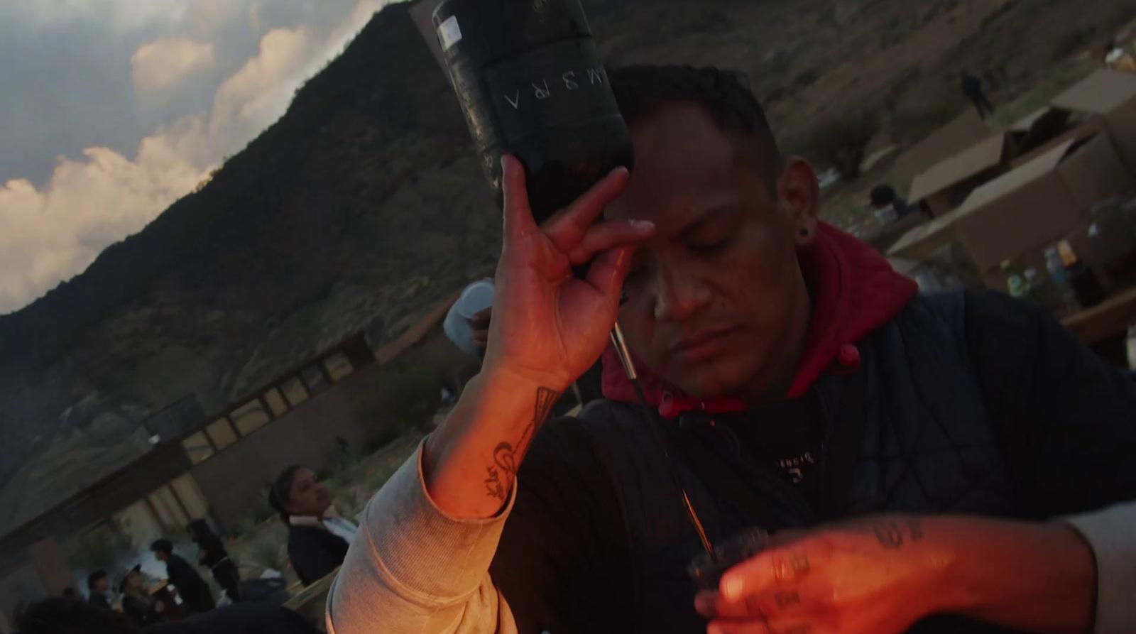 a man holding a cell phone up to his ear