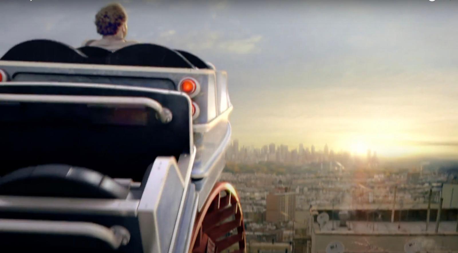 a man sitting on top of a bus looking out over a city