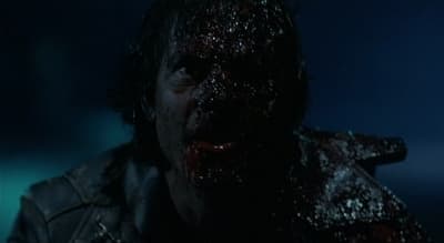 a close up of a person with blood on his face