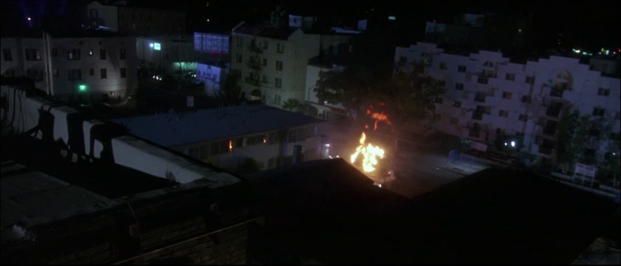 a view of a city at night from a rooftop