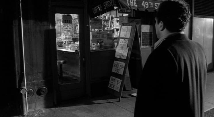 a man standing in front of a vending machine