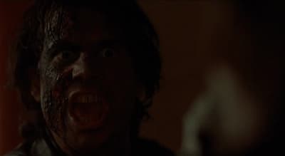 a close up of a person with a bloody face