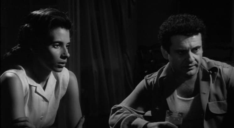 a black and white photo of a man and a woman