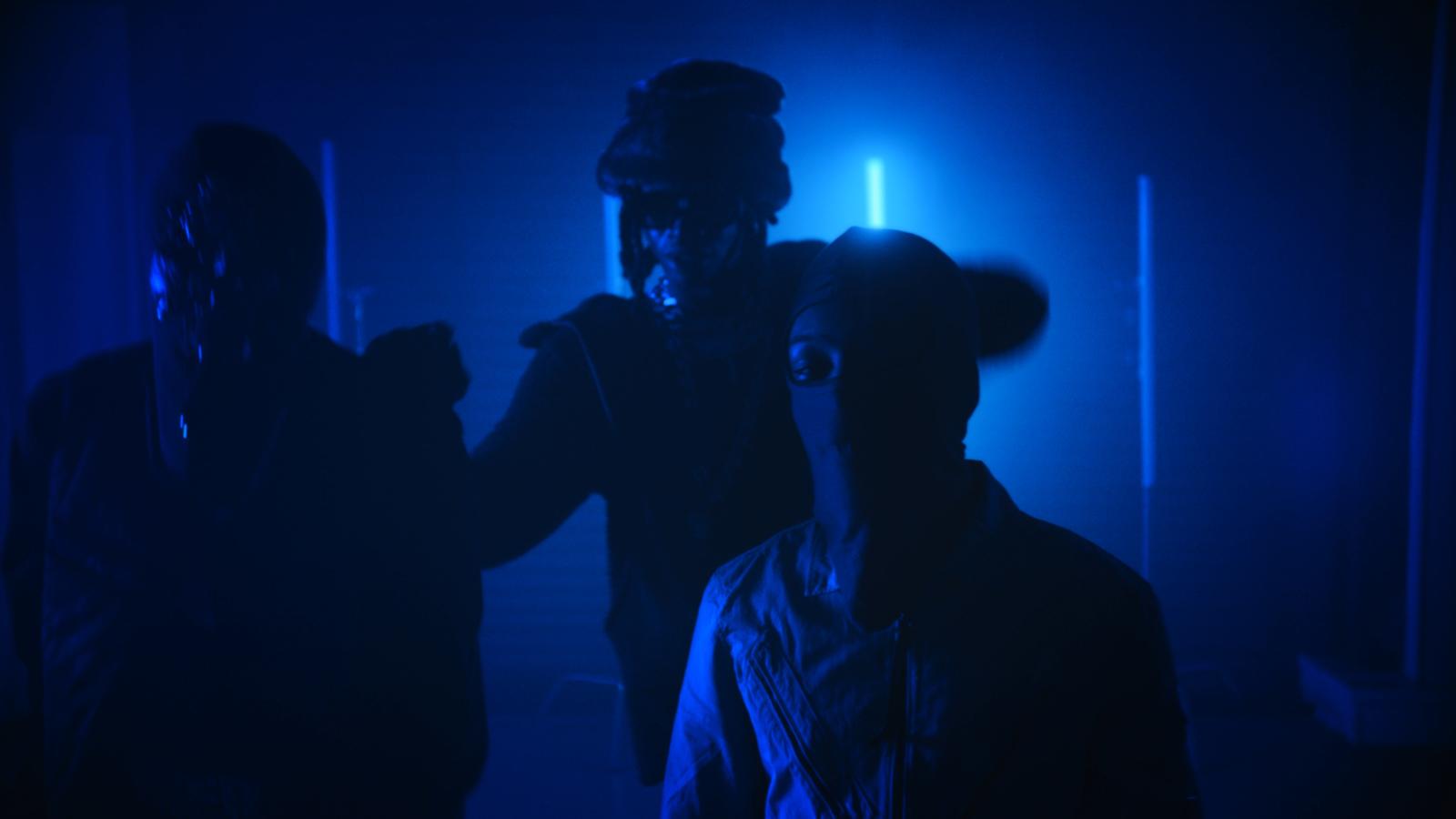 a group of people standing in a dark room