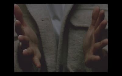 a person with their hands in the air