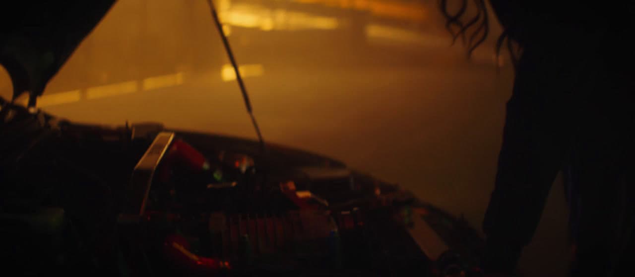 a blurry image of a person standing in a dark room