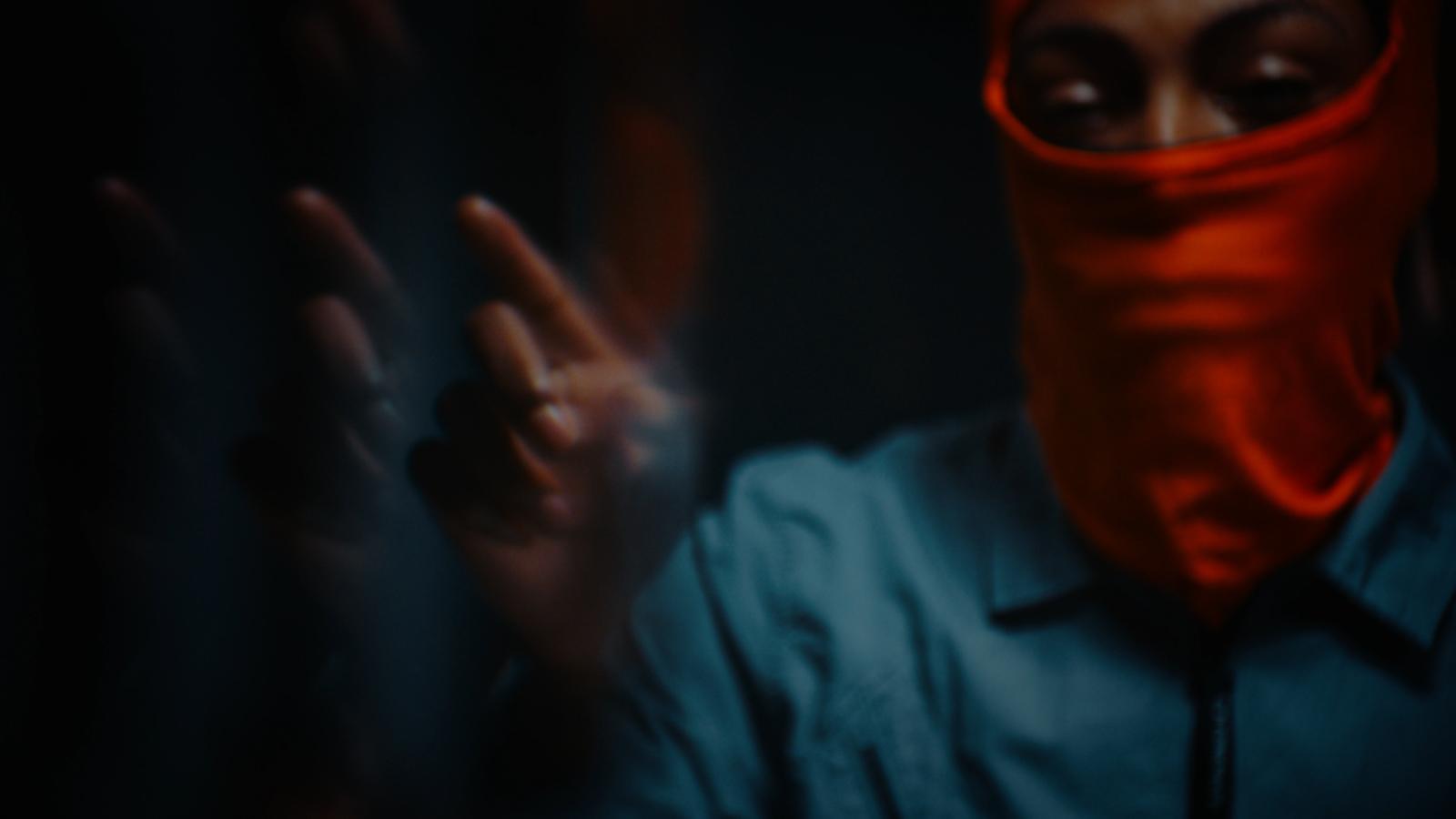 a person with a red mask covering their face
