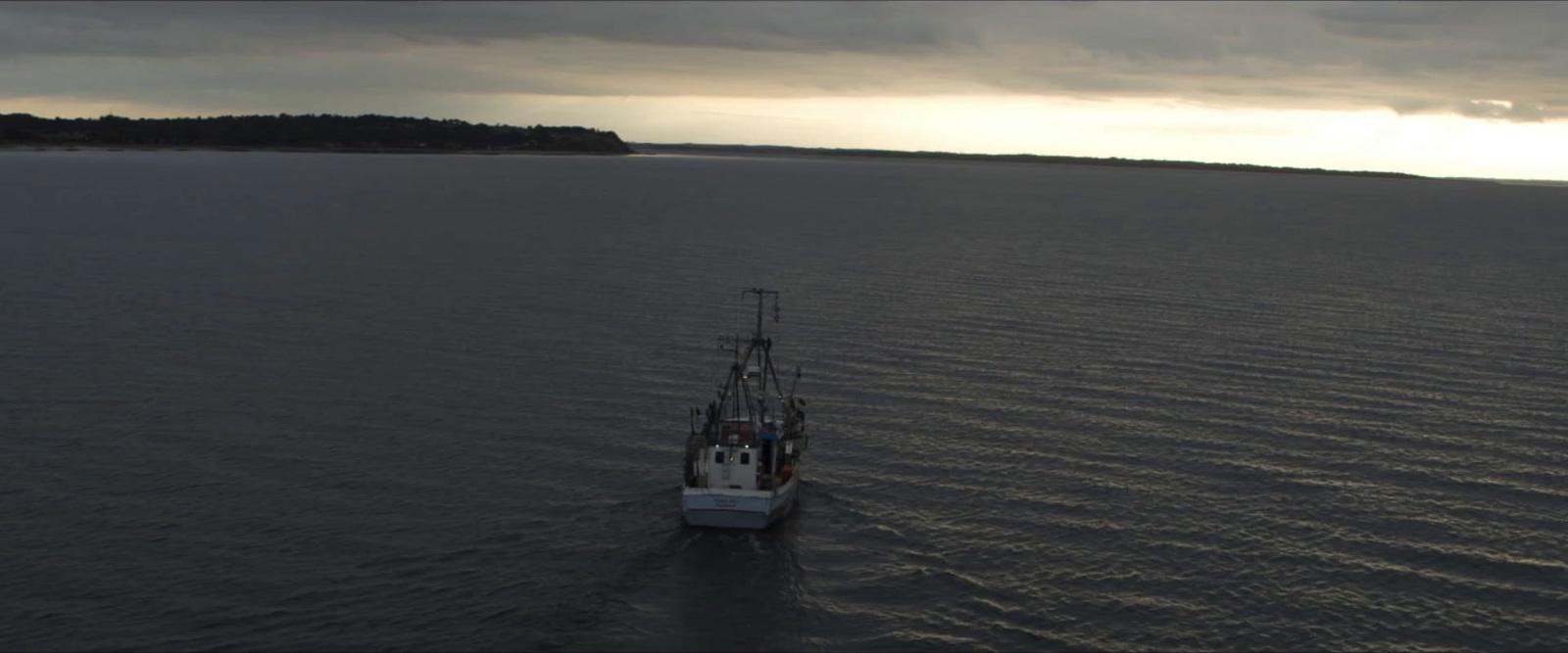a large boat floating on top of a large body of water
