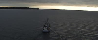 a large boat floating on top of a large body of water