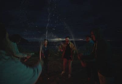a group of people standing around a firework