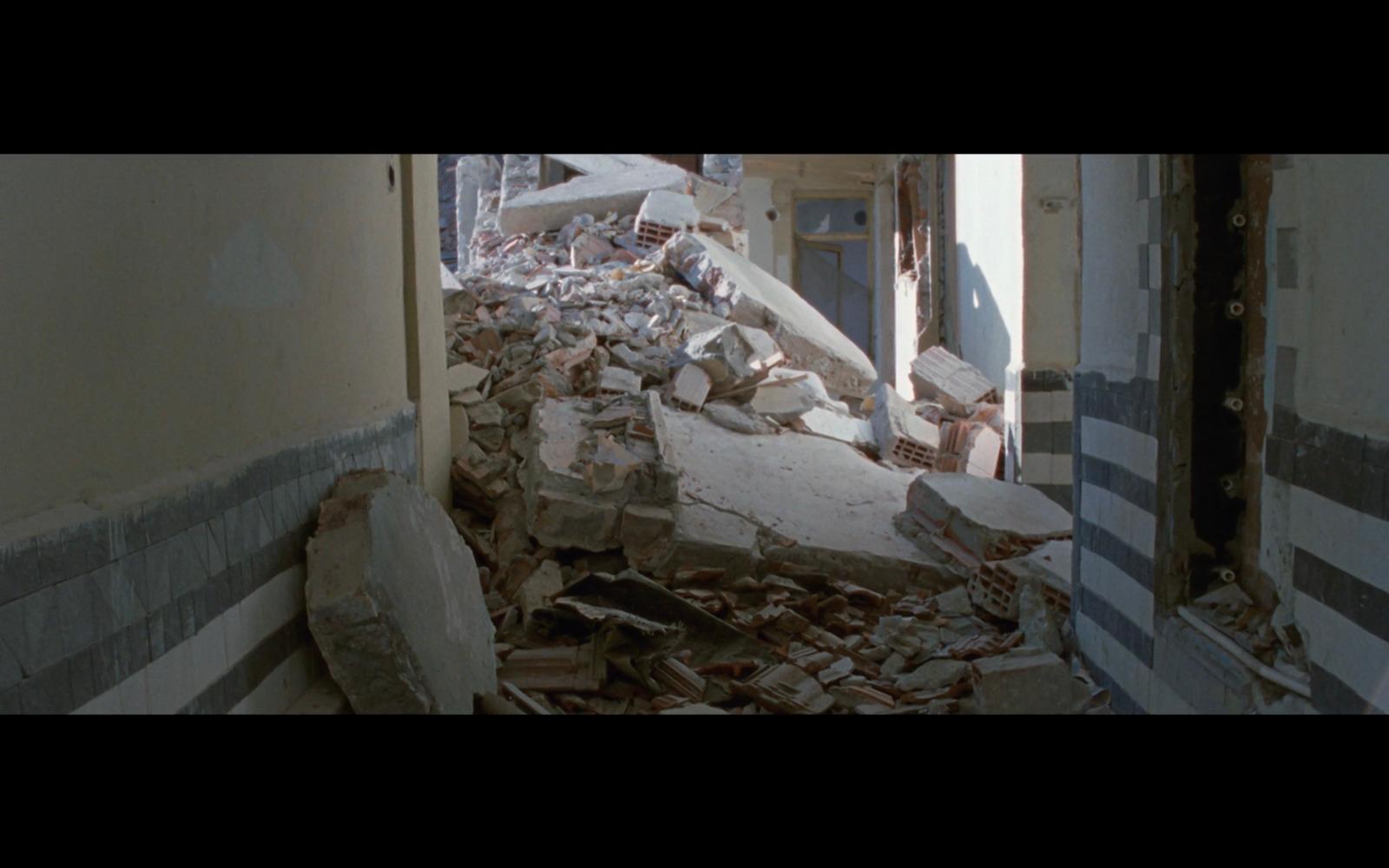a very large pile of rubble in a run down building