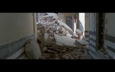 a very large pile of rubble in a run down building