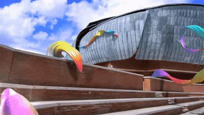 a large building with a bunch of colorful kites in front of it
