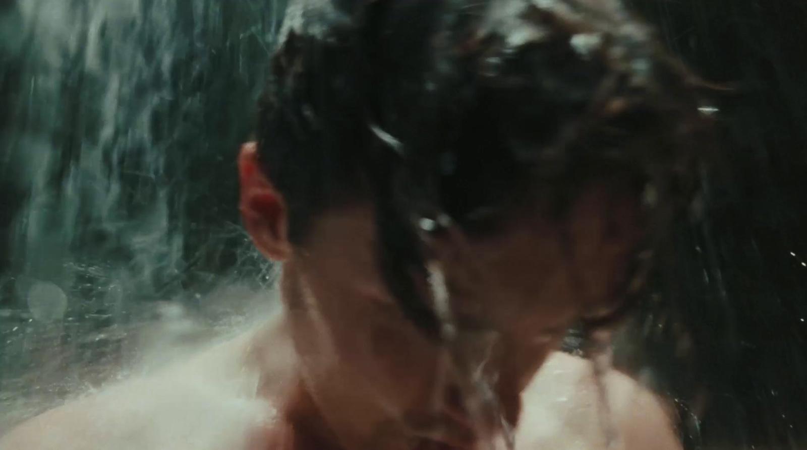 a man in the shower with his head in the water