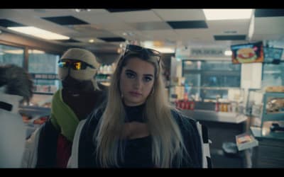 a woman with long blonde hair standing in a store